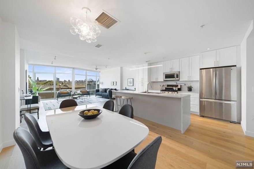 **TOM McCARTHY (201-206-8144) & The Chen Agency** present: Welcome to AVENTINE. This is an 1891-sf, east-facing duplex with a spacious private patio oasis. The welcoming entry foyer leads to an open living area with dramatic floor-to-ceiling windows that are the signature feature of this modern boutique building. Anchoring the first floor space is the center island kitchen with quartz counters & stainless steel appliances. On the 2nd level is a true primary suite featuring beautiful New York views, spacious walk-in closet and, a spa-quality bath with walk-in shower, double vanity, and soaking tub. The second bedroom features an ensuite bath, walk-in closet and access to the private rear patio. Additional details include hardwood floors, high ceilings, laundry room, office nook, 2 parking spaces, central air & gas heat. NJ Transit Bus & NY Waterways Ferry Shuttle stops are one block away. Please contact TOM McCARTHY 201-206-8144 for all showings.