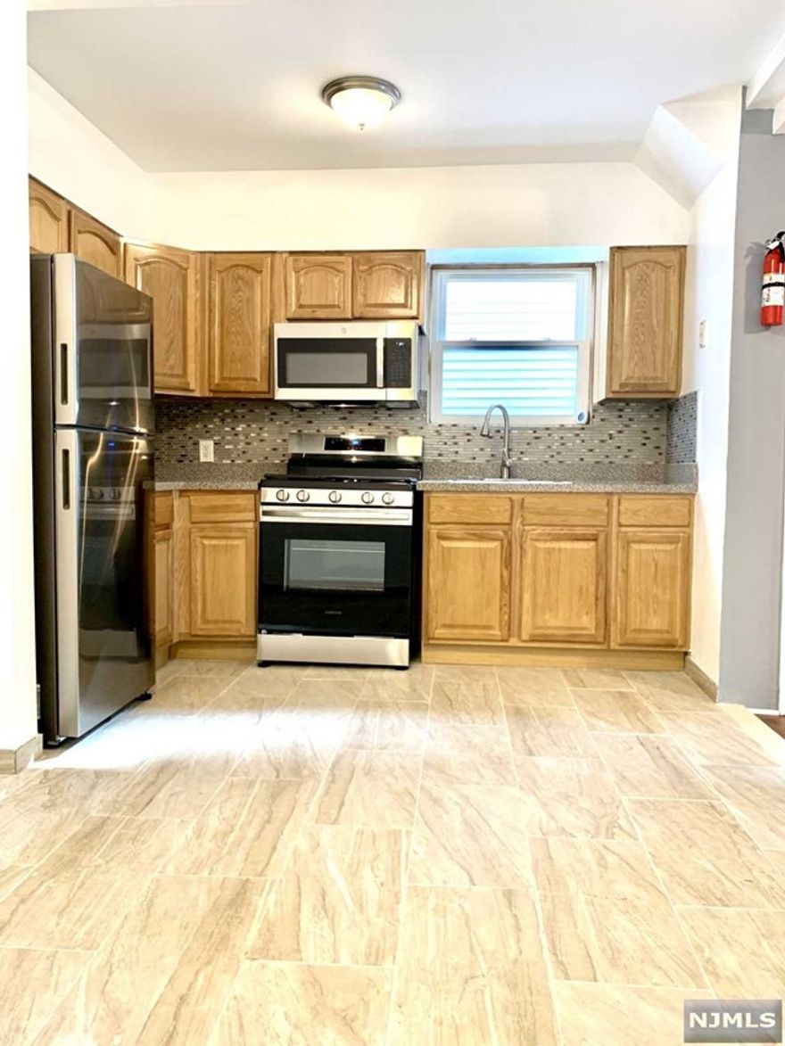 Beautiful recently renovated, sun drenched 3 bedrooms apartment. Everything has being upgraded, new bath, new kitchen, floors and more. Location is ideal, close to Train station and NJ transportation. Street parking is always available.Tenants responsible for all utilities. Available immediately