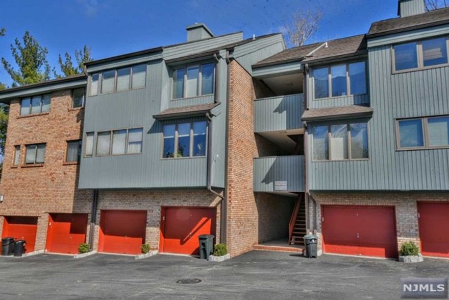 Welcome to this lovely 2 bedroom, 2 bathroom end unit in Indian Hollow! This first floor condo features new windows, an updated kitchen with granite countertops, dining room, and living room with sliding glass doors which open to the first deck. Generous primary bedroom has walk-in closet, full size bathroom and second private deck. Second bedroom/den/office. In addition to the oversized garage, there is a separate secure storage unit. This quiet community has a beautiful pool. Monthly maintenance includes water and sewer. Conveniently located near parks, shopping, and NYC transportation, with low taxes and access to top Mahwah schools.