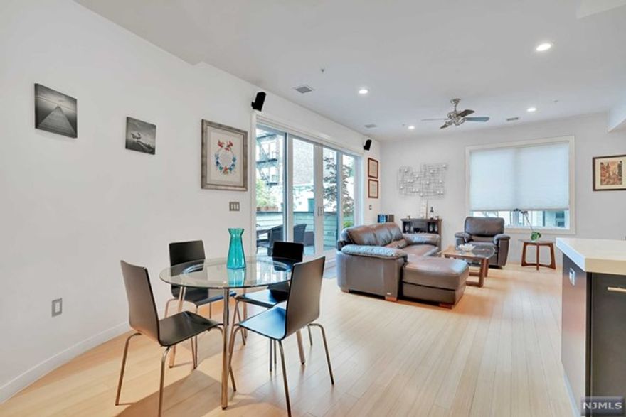 Prepare to be impressed by the most extraordinary, uniquely crafted, impeccably maintained and unusually spacious (1048 Sq. Ft.) 1 Bedroom at the chic Sartori Lofts complex. Boasting 9.5' ceilings, an impressive chef's kitchen with dramatic espresso-finish custom cabinetry, designer countertops, Venetian glass backsplash, upscale SS Bosch and LG appliances, and sunlit living and dining rooms set the scene for amazing entertaining. Enjoy morning coffee, or evening cocktails from your IPE wood decked terrace, accessible from the living room and the primary suite. Appreciate the fine bamboo flooring, the elegant custom bath with Calcutta marble, prime quality HVAC/filter/humidifier system, washer/dryer in unit, Hunter Douglas window treatments and custom closets. Elevator building with one garage parking space included in the rent. Centrally located with easy access to all Hoboken has to offer.