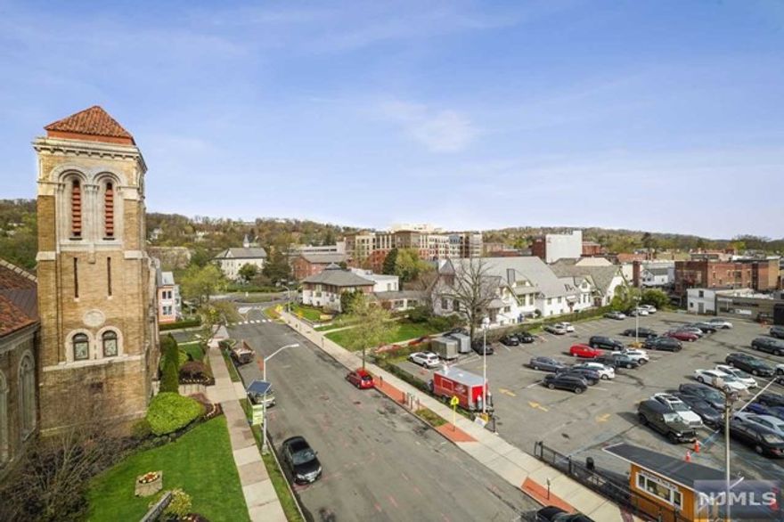 RARE SUN-DRENCHED 1 Bedroom 1.1 Bath CORNER UNIT with Expansive Views North and West in LUXURY NYC STYLE building in central Montclair. This PRISTINE home in The Siena features warm hardwood floors, GE Profile appliances, European Style Cabinets, black granite counters, breakfast bar, Walk-in closet and W/D combo in unit. SUPER RARE - NO UPSTAIRS NEIGHBOR!! Underground parking garage with one assigned parking space #57 right next to elevator. Move-in ready with crisp neutral paint. Common rooftop deck with NYC skyline views. 24-hr concierge building in the center of town. Steps to Food, Shops, Restaurants, South Mountain Reservation, Schools, NYC transportation and EWR, ONE FLOOR LIVING!