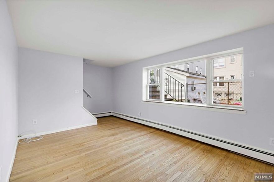 Welcome to the charming garden apartment with two bedrooms and one bathroom, situated in a highly desirable location with easy access to NYC buses. This delightful residence boasts an abundance of natural light, creating a warm and inviting ambiance throughout the entire space. The kitchen has been thoughtfully updated, offering a contemporary design and a range of high-quality appliances, making it a dream for any culinary enthusiast. The apartment features two nicely sized bedrooms, providing ample space for relaxation. The bathroom is conveniently located and has been stylishly designed with modern fixtures and finishes. The location of this apartment is truly unbeatable, situated just one block from NYC buses, commuting to the city becomes a breeze. Additionally, heat/hot water are included in the rent, coin op laundry is onsite, and ample street parking is available.