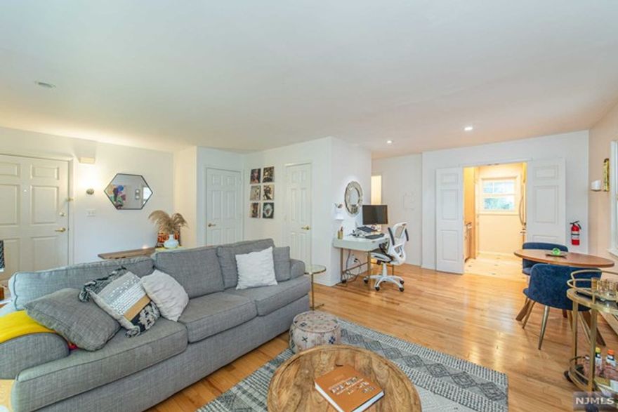 Natural light fills this open floor plan condo w/ spacious living room & dining room. In-unit laundry offers a great convenience & you'll love the large bedroom with faux-exposed brick wall & tons of closet space. A sliding glass door off the living room leads you onto your own private balcony overlooking the lush landscape of the courtyard. Back inside, you'll find an updated kitchen with stainless steel appliances - the perfect place to whip up your home cooked meals or for a good excuse to get out you'll find everything downtown Montclair has to offer just a short distance away, including: restaurants, shops, parks, Montclair Art Museum, etc. The commuter's dream and with an assigned garage parking spot as well as heat & hot water being included complete the package.