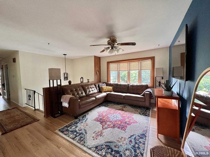 Beautiful bi-level home with an open floor plan. Custom Kitchen with quartz countertops and butcher block island, brand new appliances, plenty of cabinet space and new light fixtures. Freshly painted. Wood/Tile flooring throughout. Spacious Primary (fits King bed comfortably) with two closets and full primary bath. Additional 3 bedrooms anbd 2 full and 1/2 bath. Bottom floor includes family room, additional bedroom, washer/dryer and 1 car garage. Back yard fenced in with large in-ground salt water pool (new DE filter and liner). Home has brand new central HVAC system (installed Aug 2022). Located in desirable neighborhood with blue ribbon school district. Near Schools, 5 minutes from train, close to Rt 22, I78 and I287, Warren Restaurants and Bridgewater Shopping Center.