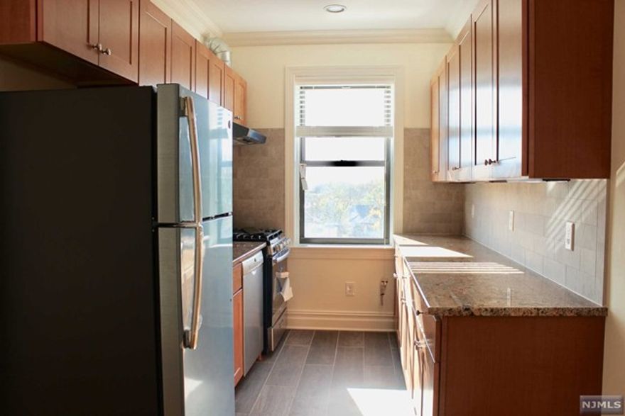 SOHO COMES TO NO. JERSEY!! YOU WILL FALL IN LOVE WITH THIS LARGE, BRIGHT & UNIQUE INDUSTRIAL STYLE 1 BEDROOM APT. BEAUTIFULLY RENOVATED WITH ALL THE MODERN CONVENIENCES, IT IS COMBINED WITH THE ELEGANCE OF A HISTORICAL ART DECO BUILDING. THE APARTMENT BOASTS UPSCALE FEATURES & FINISHES SUCH AS CENTRAL HVAC; OPEN DUCTWORK; SLEEK KITCHEN WITH S/S APPLIANCES (INCL. BOSCH DISHWASHER); GRANITE COUNTERS; SOLID WOOD MAPLE SOFT CLOSE CABINETS. GORGEOUS WIDE PLANK HARDWOOD FLOORS; CROWN & BASE MOLDING; HIGH CEILINGS; RECESSED LIGHTING; CEILING FANS; WINDOW TREATMENTS; TILED BATH WITH PEDESTAL SINK; BUILT WITH EXTRA SOUNDPROOFING. LAUNDRY IN BRIGHT BASEMENT. STREET PARKING BUT EASY TO FIND SPACES. BORDERING ON PALISADES PARK, IT IS CLOSE TO ALL HIGHWAYS, SHOPPING & BUS TO NYC. IT'S THE TALK OF THE AREA--GREAT SPACE AT A GREAT RENT! IT'S NOT YOUR COOKIE CUTTER APARTMENT!!! MAPLE GARDENS IS A SMOKE FREE BUILDING! ABSOLUTELY NO PETS PLEASE!!