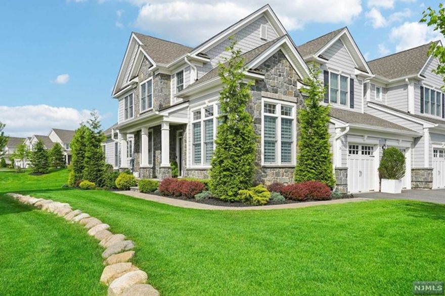 Welcome to The Reserve at Franklin Lakes, Bergen County's premier luxury townhouse community. Enjoy upscale amenities like a pool, clubhouse, and park-like outdoor spaces. This stunning home features 3 beds, 4.5 baths, and a bright, inviting layout. The main floor boasts an open kitchen and family room with a cozy gas fireplace, while the master suite offers a private retreat. Two additional en-suite bedrooms provide ample space for guests plus a loft. The lower level features a rec room, full bath, wet bar, library, and gym. Equipped with smart home technology and cable hook-ups, this residence is move-in ready. Outdoor highlights include a full kitchen and spacious deck, perfect for entertaining. Come experience luxury living at The Reserve!