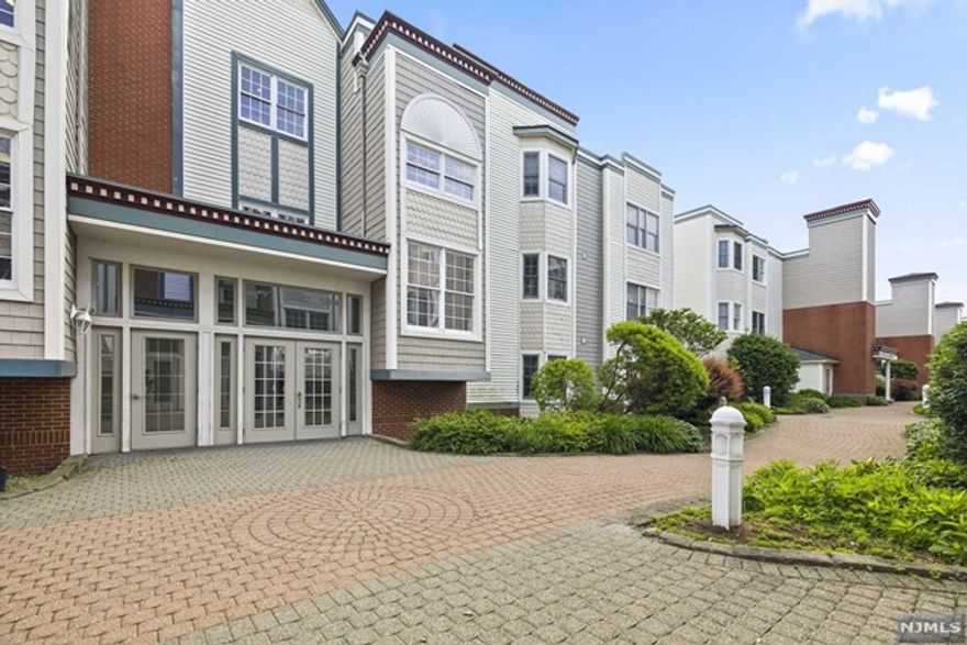 This condo features hardwood floors, kitchen with granite and a living room that opens up to a balcony that faces NYC.