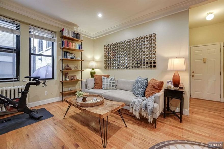 Beautiful and spacious one bedroom/one bathroom CONDO on Blvd East. This home features a fabulous layout with an expansive living room, separate dining area, updated kitchen with stainless steel appliances and spa- like bathroom. Additional features include hardwood floors throughout, recessed lighting and a generous sized bedroom. All of this in an impeccably maintained pre-war building that boasts a gorgeous marble lobby, elevator, bike storage and laundry in the basement. Step out the front door and take in the gorgeous view of the NYC skyline! Easy commute to NYC close to parks and restaurants. HOA includes heat & hot water.