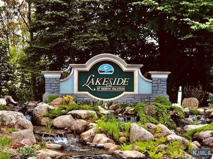 Stunning Lakeside at North Haledon town home situated on the Lake! Perfect location! This wonderful unit has 3 levels of living. Formal Living room features recessed lighting with 2-story ceilings, wall of windows and fireplace with views to the lake. The formal living room opens to the dining room and has a wonderful open feel perfect for today's entertaining. Continue by stepping out on the deck and embrace the magnificent view of the lake! Powder room and entrance to garage complete the first floor. The second level features the private primary suite with an exquisite bath and walk in closet, an additional bedroom, currently used as an office full bath & laundry room complete the second floor. The lower level walk out basement features a sitting room/family room or possible gym/rec-room with plenty of space for storage. This spacious lower level also leads to sliding glass door to lower level patio and the idyllic lake view.