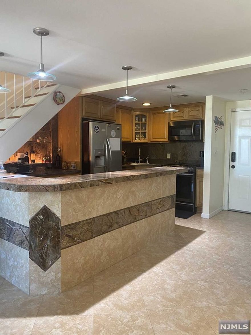 Experience luxurious city living at its finest with this stunning 2 bed/2.5 bath duplex Condo in Elizabeth City. Impeccably renovated kitchen, floors & center island w/Stainless Steel appliances plus Jacuzzi hot tub! Includes two parking spaces + access to a private laundry in-unit. Hardwood Floors, Central AC/heating. Elevator Building. Close to transportation, Newark Airport just minutes away. Credit and Income Verification Applies