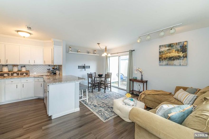 Do NOT miss this sun-drenched, move-in ready sweetheart end unit just moments away from 9-hole Deer Run Golf & Tennis Club! 1st flr features lux vinyl floor, open floor plan w/ living/dining room combo, big eat-in kitchen w/ stainless steel appliances, plenty of cabinetry, pantry, granite counters w/ breakfast bar. Sliders take you to your own adorable personal patio for al fresco living perfect for entertaining. Upstairs boasts spacious bedroom w/ walk in closet (enough space for home office desk or Peloton bike!), updated full bath & convenient stackable washer/dryer. Storage in attic & closet outside front door. 1 assigned parking spot in front w/ plentiful guest parking. Enjoy central air, clubhouse, in-ground pool, tennis & pickle ball courts, VERY pet friendly HOA, free golf w/ carts, driving range & golf pro for lessons. Near Rt 80/287/202/46/23, NYC: Willowbrook bus/Towaco & Mountain View Train Stations, shops & restaurants. Full time resort living year round!