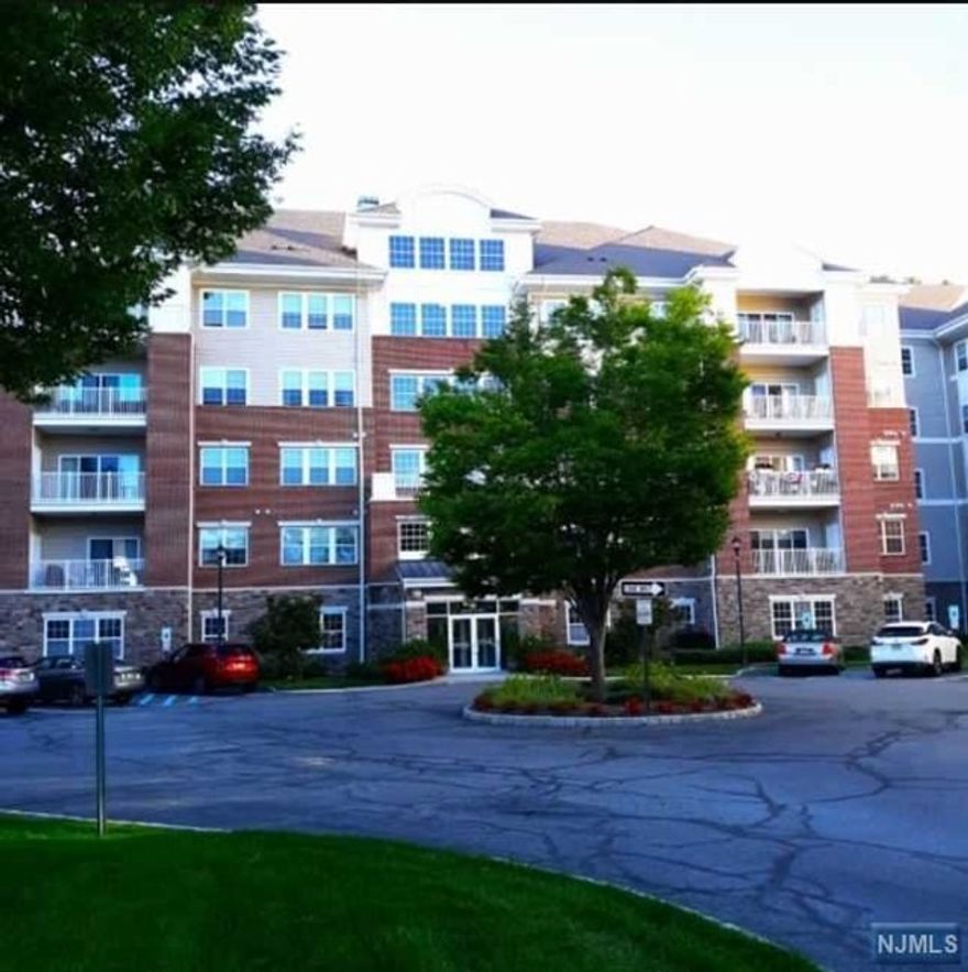 Move in ready active adult lifestyle community-Wanaque Reserves that features 24 hr. Gated community, assigned garage parking space w/storage bins, under building w/elevator. Open floor plan, hardwood throughout except tile in Kitchen, Baths and entryway. Large 2 Bedrooms, 2 full Baths, spacious, 1 owner unit, tons of natural light and views, Formal Dining Room, Living Room w/sliders to covered deck w/view of mountains/ tennis courts, Family/Den w/French doors, Eat in Kitchen w/pantry and Laundry room w/sink & cabinets. Master suite offers trey ceilings, 2 closets, 1 walk in, dressing area & private bath, additional Bedroom and Bath off Living Room. Beautiful detailed crown molding, chair rail, trim accents and ample closets & storage on deck. Great amenities incl. indoor/outdoor pool, hot tub, sauna, gym, cafe, tennis/pickle courts, bocce and shuffleboard, theater, billiard, card, game, craft, and meeting/event rooms and many various clubs and activities to join.