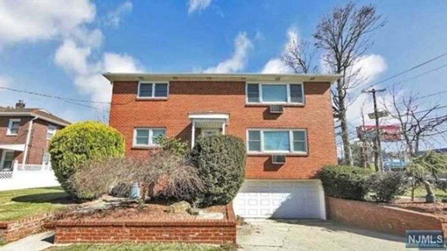 Spacious and renovated first-floor apartment with 2 bedrooms, 1 bathroom, and a modern kitchen featuring quartz counters and new appliances. Basement can be used as an office or home fitness area, with an updated bathroom. Includes a 2-car garage and hardwood floors throughout. Perfect for rental with attractive features and a nice yard..