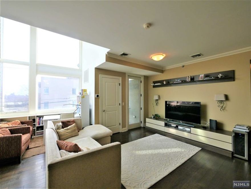 A Rare Find!!! This Immaculately Maintained 2Br/2Ba with Balcony features Spacious, Open Layout Concept, High Ceilings, Oversized Windows, Chef's Kitchen with Stainless Steel Appliances & Granite Countertops, Hardwood Floors, Washer & Dryer, Abundant Closets & a Good Vibe!!! Location is simply unbeatable, just steps to everything, Transportation to NYC, Shopping, Fine Dining, Entertainment and much, much more.Truly a Must See Property! Won't last.