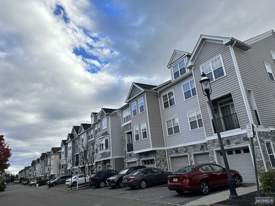 Beautiful townhouse at desirable Cambridge Crossing gated community. Very well maintained unit that you enjoy brand new roof (in 2022), updated garage door with remote opener & bluetooth option (in 2020), updated lighting, higher end LG S/S appliances, granite countertops in the kitchen and bathroom, hardwood floor throughout (except carpeted stairs and attic), and new balcony door (in 2020). Convenient locations to super markets, shops and restaurants, easy access to highways (80, 46 and parkway), and public transportation is only 0.5 mile away. Easy commute to NYC) Property being sold "AS IS". There is an assessment that the seller paid in full upfront. The buyer will be responsible for prorated portion.