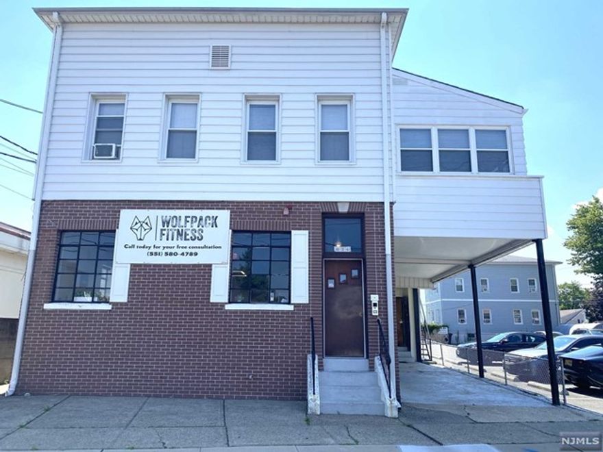 Four unit mixed use building with 2,000 sq ft of commercial space on the first floor (rent is $2,000/month) and 3 apartments on the second floor. Large 3 bedroom apartment (rent is $1,750/month, large one bedroom apartment (rent is $1,500/month) and nice sized 2 bedroom apartment (rent is $1,200 a month). Rents are all below market value. Central A/C, huge basement, steel beam construction and driveway for 2-3 cars alongside building.