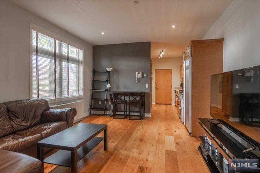 Experience the epitome of modern living in this one-bedroom condo, featuring an updated kitchen, high-end stainless steel chef-grade appliances, and two spacious double closets. The unit boasts high ceilings, an in-unit washer and dryer, and a luxurious soaking tub, living room / dining room combo. Additional amenities include two dedicated parking spaces, a storage locker, and access to the rooftop deck. Near parks, school, restaurants, and shopping, NYC trans.