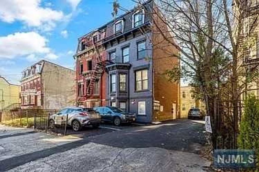 Fully Renovated apartment in Brick Building! 4 story building with modern contemporary 2 bedroom apartments, fireplaces, closets, storage & bathroom with lots of natural lighting. Exclusive long drive way and potential off street parking at the front and rear of the property. The home features an open plan design with high end finishes. New flooring, kitchen cabinets, granite countertops & island, ceramic bathrooms, custom windows & doors, recess lighting, stainless steel appliances including stove & dishwasher. New Plumbing, Electrical, Cooling, Heating Fire Alarm & Sprinkler System, Security Cameras, Intercom, Large Basement with separated utilities & fire escape. Located on the border of West Side & Bergen - Lafayette on a one way street in a quiet section of Jersey City, a neighborhood with a vibrant and diverse community. Walking distance to JFK Blvd, New Jersey City University, Richard ST Light-rail station and 20 Minutes away from New York!