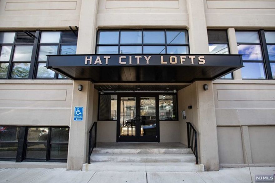 Enjoy contemporary loft living in a late 19th Century Hat Factory located in a vibrant arts community. Built in 1864 and renovated in 2017, The Hat City Lofts community is located in one of the three original buildings of the F. Berg & Company complex in the Valley Arts District of Orange. This gorgeous unit is complete with 2 bedrooms, 1.5 baths, resident parking, office space, open kitchen with stainless-steel appliances and granite counter tops, open concept living & dining rooms, original exposed brick walls, high ceilings, large windows, hardwood floors, in-unit laundry, and spacious courtyard. Some great perks are low taxes via a 20-year tax abatement and easy commute to NYC with the New Jersey Transit Highland Ave station just 2 blocks away.