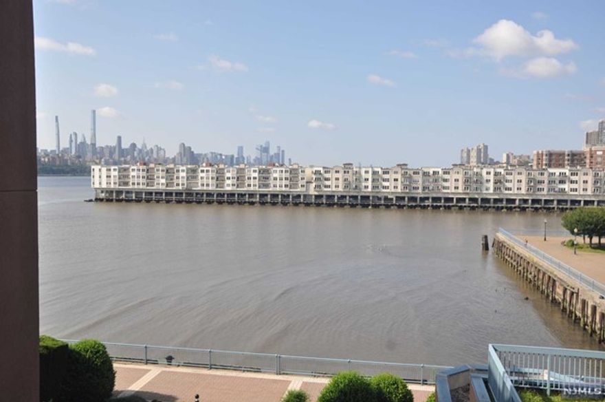River front community. Smith Ct is the newer addtion built in 2001. This large 1,592 square feet is facing east and south with and NYC midtown down south river view.Master BR has separate Jacuzzi and a shower with walk-in closet. Open space for large LR/DR combined and filled with sun light. Two parking spaces 1 in(#951) and 1 out(#1116) on the deck. NYC bus stop in front of the complex.Gated security, club house, gym, pool and tennis ct. Access to river front walkway to Edgewater Commons.