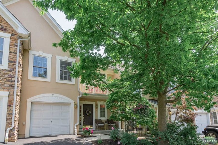 Welcome home to sophistication and elegance. This 2 BR 2.5 BTH meticulously maintained Amherst model with stunning views of NYC will not disappoint! Beautifully landscaped entrance with relaxing front porch! White kitchen remodeled in 2016 with center island, SS appliances and granite countertops. Slider to private patio with parklike setting. Formal dining room, 2 story spacious LR 5" wide plank wood floors and gas fireplace, First floor powder room and garage entry . Open second floor has beautiful Primary BR with cathedral ceiling, walk in closet and private porch. Updated MBTH w/granite, stall shower and jetted tub. Additional BR with NYC views and wide plank floors. Main full bath with granite & convenient laundry room complete this floor. Designer light fixtures, custom window treatments and ceiling fans throughout. Located on quiet cul de sac. Enjoy resort style living at its finest! Clubhouse, gym, pool, hot tub, boating, fishing,& tennis! Easy commute to NYC.