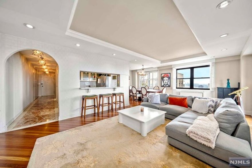 Modern PH Bliss on the Top Floor of the Parker Imperial. Enjoy the Private Balcony on the 30th floor with breathtaking views of the neighboring 167 acre park with lake, tennis courts and captivating sunsets. Wrap around windows and lots of natural sunlight make this Southwest Corner PH a delight to wake up in. Special Features; High architecually designed ceilings in the living room with recessed lighting, an open concept chef's delight kitchen with Newer SS appliances, white laquer cabinets, quartz counter tops. The layout is perfect for entertaining family and friends but also great for everyday living. Quality wood flooring thoughout the large living room and formal dining room. The King Sized bedroom fits plenty of furntiture and has 2 walk-in closets and an en-suite. High ceilings and lots of closets throughout. The Parker Imperial is full amenity luxury doorman bldg. Transportion to NYC, J.C. and Hoboken @ door. Call Jimmy Lopez - Group Twenty Six, LLC 201-741-6298 to see.