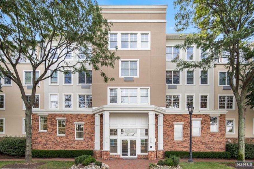 No special assessments! HOA is only $886.91. This luxurious 1 BR, 936 sq ft waterfront condo offers stunning views of the Port Liberte canals from every room in a 24-hour gated community. The open living and dining areas lead to a private balcony. Recently updated with recessed lighting and fresh paint, the unit features a gourmet kitchen with granite countertops and GE Profile appliances. Elegant wood floors, a spacious bath with a soaking tub, seamless shower, double vanity, and California Closet organizers enhance the space. In-unit washer/dryer and indoor parking are included. Amenities: two pools, including an infinity pool, tennis and basketball courts, fitness center, saunas, playground, clubhouse, dog park, and shuttle to Grove St. PATH station.