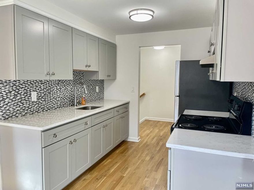 THIS LIGHT AND BRIGHT NEWLY RENOVATED SECOND FLOOR APARTMENT FEATURES STAINLESS STEEL APPLIANCES AND HARDWOOD FLOORS THROUGHOUT. WITH EXTRA LARGE CLOSETS FOR AMPLE STORAGE. APARTMENT INCLUDES A GARAGE AND PARKING. IT OFFERS BOTH CONVENIENCE AND COMFORT. PLUS, ITS PROXIMITY TO RAMSEY DOWNTOWN SHOPS, RESTAURANTS, AND THE TRAIN STATION MAKES IT AN IDEAL LOCATION FOR URBAN LIVING. LANDLORD PROVIDES WATER, GARAGE, PARKING, SNOW REMOVAL,AND LAWN CARE. TENANT IS RESPONSIBLE FOR GAS, ELECTRIC, CABLE, REALTORS FEE, SECURITY DEPOSIT, AND NTN FEE (PER RESPONSIBLE PARTY). VACANT APARTMENT PHOTOS ARE FROM APARTMENT 58 #2, WHICH IS THE SAME APARTMENT LAYOUT WITH EXCEPTION TO THE KITCHEN CABINET COLOR WHICH IS GREY IN 56 #2.