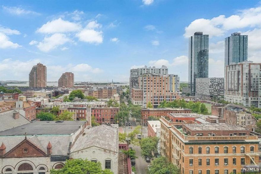 Experience the epitome of urban living in this luxurious one-bedroom condo situated in the heart of downtown Jersey City. Located in a doorman building with lower carry costs than most buildings in downtown Jersey City, this bright and spacious, south-facing large one-bedroom offers stunning views of New York City and The Statue of Liberty. Step into this meticulously maintained unit and be greeted by an abundance of natural light streaming through large windows in every room. One of the standout features of this doorman building is that it is a Coop with no application process. The HOA fee covers water, electric, gas, AC/heat, and taxes, with the added benefit of being 47% tax deductible. Residents also have the option of rental parking, providing hassle-free transportation. For commuters, this location is a dream come true, as it is just one long block from the Grove Street PATH station. Within minutes, you can find yourself in the bustling streets of downtown Manhattan.