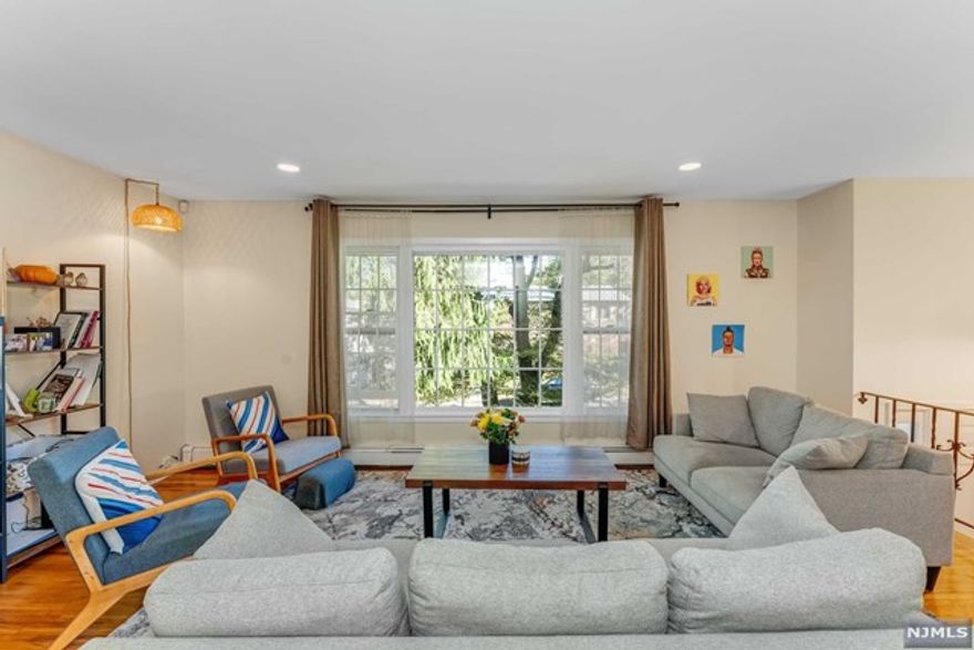 Presented by The Rapaport Group-Tami Rapaport 201.665.5558 Get Ready for 2025! This beautiful home, located on a quiet dead-end street, is the perfect place to kick off the new year. It features a modern eat-in kitchen and newly renovated bathrooms, all with hardwood floors throughout and central air conditioning. Enjoy cozy evenings in the family room with a fireplace. The property includes a two-car attached garage, a spacious backyard, and a large deck ideal for outdoor entertaining. Plus, you're just a short walk to NYC transportation and excellent schools. Don't miss this wonderful opportunity to start 2025 in style!