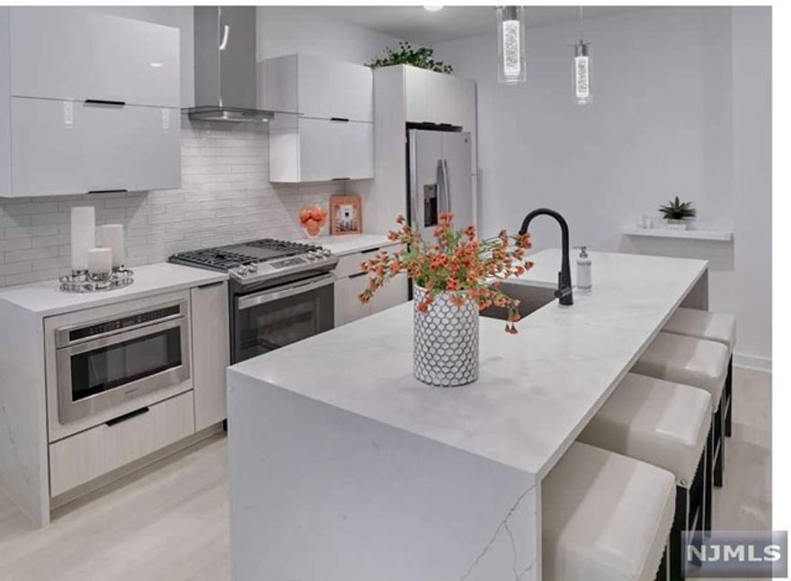 Newly constructed boutique luxury living at its finest located in the heart of prestigious Franklin Lakes. Customized to provide flexible live and work options while never compromising on style, this light and bright unit features 9 ft. two floors of living space, master bed/bath on second floor, modern eat-in kitchens with Quartz countertops & Stainless steel appliances, living room/dining area, two bedrooms including large primary bedroom suite with spa-like bathroom and walk-in closet, stylish hall bathroom and laundry. The building is loaded with amenities including fitness center, golf/sport simulator, playroom, movie/media room, community lounge with pool table, workstations, expansive outdoor patio with grilling stations, fire pits, dog run and dog bath. Each unit comes with one underground parking space equipped with EV charger hookup. Additional parking and storage available. Just unpack your bags and enjoy! No broker fee!