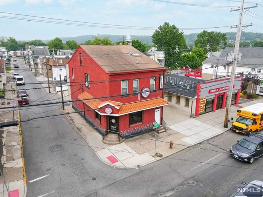 Investment or Owner User. This income producing property consists of two rented apartments upstairs and a vacant turnkey bar with liquor license on the ground floor. The property has parking for both tenants and patrons. The asking price includes the class C liquor license. MTM residential tenants immediate cash flow and present a value add opportunity to increase rents with modest improvements and longer lease terms. For investors, the pro forma rent on the ground floor is $22- 25psf psf NNN. This site is located 1 mile from William Paterson University which has over 9,000 registered students. The ground floor bar is turnkey with all beer/ soda lines in place, refrigeration, kitchen, and bar in addition to a basement office and storage area. Terra Cotta roof and brick interior are consistent with a tapas style restaurant/ bar. 7% cap rate in year 2 based on pro forma rents.