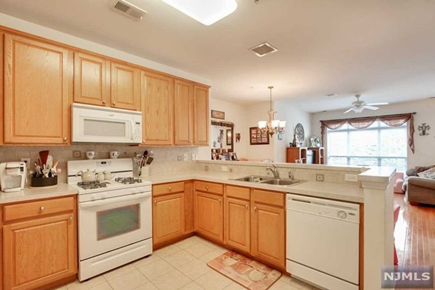 Montclair unit at Essex Park. Offers a terrific open floor plan with plenty of natural light. First floor boasts hardwood floors, spacious working kitchen with breakfast counter. Large bedrooms including a master suite with walk in closet and full bath. Garage attached for easy access to home. This wonderful, gated community is located across from Hendricks Field Golf Course, close to NYC transportation, and offers outdoor swimming pool, clubhouse and convenience to shopping. (Note: photos were taken prior to current tenant).