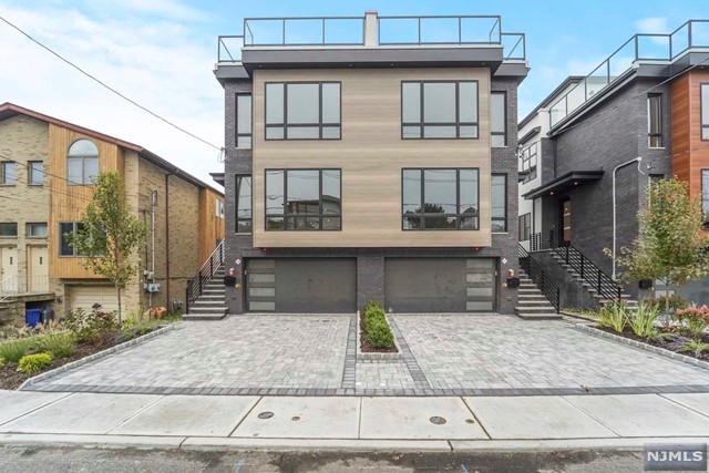 Brand New, Oversized Unit Located on Desirable Myrtle Ave. Each Townhome features Large & Open Floor Concepts Tied Together with South Facing Sunlight Exposures. Step Inside to 4 Bedrooms, 4.5 Bathrooms on 4 Levels of Living. Main Floor Introduces the Chefs Kitchen Equipped with Bosch Appliances, Custom Cabinetry, Waterfall Quartz Island, Walk Out Terrace, Entertainment Area + More. Living Room Area Welcomes South Facing Views, Tile Wrapped Fireplace, and Custom Shelving. Built In Speakers Throughout House. Second Floor Includes Primary Bedroom & Bathroom, 2 Addt Bedroom+ A Full Bathroom. Main Suite Includes Accent Wall, Closet Spaces, and Primary Bathroom- Dual Vanities, Soak in Tub, Wall Mounted Toilet+Quartz Wrapped & Kohler Faucets. Top Floor Includes Oversized Rooftop, Rec Room. Wet Bar Area & Half Bath- Perfect for Hosting! Ground Level Includes Bedroom with Full Bathroom, Large Rec Room, Wet Bar Area, Mudroom, Backyard and Garage. Near NJ Transit, GWB, Parks & Schools.