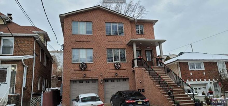 Please don't miss this extra large sized beautiful 2 Family house on 2nd floor with large family room, 3 bedrooms, 2 full baths. This house is located in a quiet residential area of Palisades Park, and very spacious open layout with tray ceilings in the living room and all bedrooms. ,beautiful open kitchen with top of the line appliances and granite counters, sliding glass door to a large deck. Walking distance to Broad Ave. for shopping, restaurants and NYC transportation.