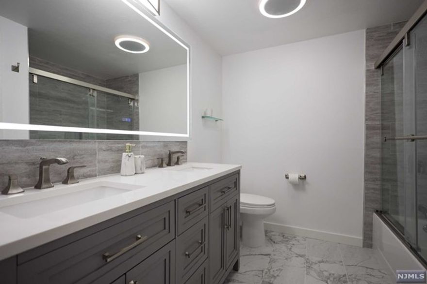 Radiantly Renovated and Spacious Condo in Newark! Nestled in a highly desirable area near a ton of amenities, this 2BR/1BA residence offers both exceptional form and superb function. Recently renovated, the entertainment-ready interior dazzles with gorgeous faux wood flooring, a crisp color scheme, tons of natural light, a large living room with balcony access, and an open concept kitchen featuring stainless-steel appliances, solid surface countertops, white cabinetry, double stainless-steel sinks, dishwasher, and an adjoining dining area. Relax in the primary bedroom, which has an enormous closet and recessed lighting. One additional bedroom is generously sized and may be used for a home office, guest area, or a lifestyle-specific flex space. Remodeled to interior design perfection (March 2022), the luxe bathroom includes a shower/tub combo, a sizeable storage vanity, chic color-changing light fixture with built-in speaker, and LED touch sensor mirror.