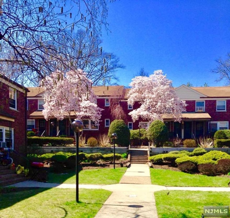 1 bed/1 bath lovely end unit on the first floor with eat in kitchen, Ideally for NYC/NJ commuters. Just one block to GWB plaza or to NJ buses. School #1 E.S.HOA fee includes heat, water and assigned parking space. Laundry on the premises. Close to shopping, parks, schools, restaurants.