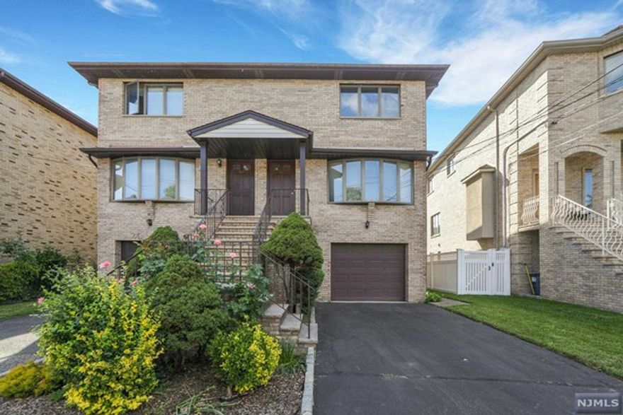 Bright and spacious duplex featuring 3 bedrooms, 2.5 bathrooms (Basement not included), and hardwood floors throughout. Includes a 1-car garage with driveway, a large master bedroom with full bath, beautiful open modern eat in kitchen with ss appliance and brand-new Samsung oven with deck access. The open living/dining area is complemented by central A/C and central vacuum, with laundry conveniently located on the 2nd floor. Ample storage and closets. a skylight that allows for ample natural light. Will do necessary repairs and paint all window frames white. It will look even nicer than it does now.EV charger in the Garage.Walking distance to restaurants, schools, and stores, with easy access to the GWB, major highways, and 5-minute walk to NY bus station