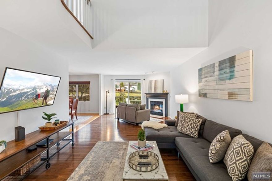 This move-in ready Fells Manor townhome is spacious, bright, welcoming and beautiful. It's situated in a PRIME location with NYC bus and vibrant town center in downtown Caldwell town just blocks away. Grade A schools and world class parks are within close reach as well! This sprawling 2 bedroom townhouse offers 3 levels with lofted ceilings and sunshine pouring in. The primary bedroom boasts a private balcony overlooking gorgeous greenery and also features an en-suite bathroom with double vanity, stall shower & jetted tub. Enjoy storage galore with 2 walk in closets. You'll love entertaining your loved ones in the large and welcoming open concept on the first floor: a wood burning fireplace, an airy dining room and outdoor access to a second private deck rounds this space out to perfection. The finished basement with a full bathroom and a gym space is just the cherry on top!