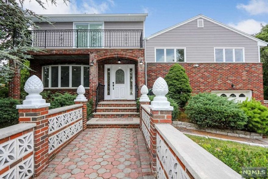 WOW...no expense has been spared in this amazing home by areas' TOP Builders! Attention to every detail is evident throughout this spacious, 4BR/2.5 Bth lovely Split Level in the desirable town of Dumont! A truly beautiful home. Welcome all your guests into the open concept floor plan with gleaming HW floors, crown moldings & recessed lighting. The LR leads into the dining area with doors to a patio overlooking the nice size yard; perfect for outside entertaining! You'll love to cook in the designer Chef's Kitchen with high end SS appliances, Wall oven and Microwave and even a wine fridge, quartz counter-tops & designer white cabinetry. 2nd floor boasts 3 BR's & full bth. The huge, beautifully finished 3rd floor offers a King Size Primary Bedroom with a stunning primary bath and 2 walk in closets. Sliding glass doors to the terrace for morning coffee in the summer is sure to please. Finished bsmt, 1 car attached gar, new HT, A/C, siding are just a few of the many feature.