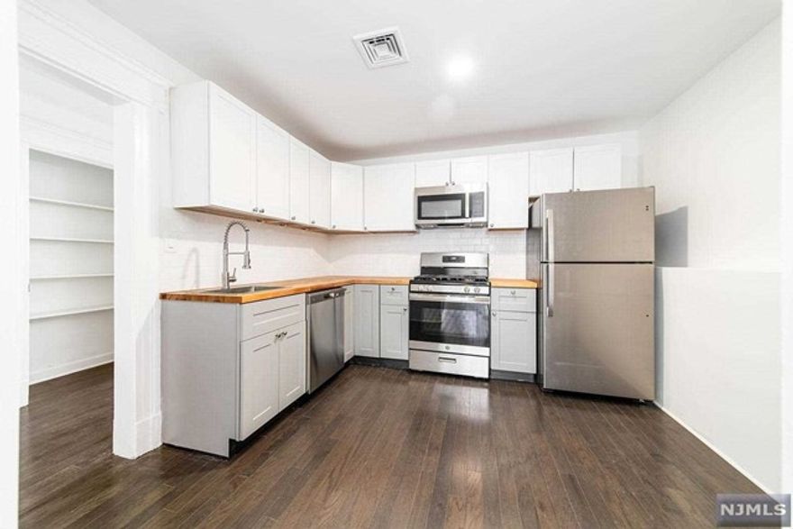 Newly renovated, spacious 3 bedroom & 1 bathroom apartment in the heart of Englewood business district on a charming Street. Fully Equipped kitchen w/ALL new stainless steel appliances. Beautiful hardwood floors throughout and large windows allowing for amazing natural light. Open floor plan with dining rm/ living rm combo which leads to the eat-in kitchen. The primary bedroom features large closets. There are 2 additional bedrooms, and a full bathroom in this spacious and charming apartment. Features: central AC/HEAT, high ceilings, recessed lighting. Public transportation at the door. 3 mile drive to GWB. Close proximity to shopping, restaurants & much more. Tenants pay all utilities. Street parking. Due at signing of lease: 1st month rent + 1.5 month security deposit, 1-month broker fee. Good credit (700 or higher) and verifiable income required.