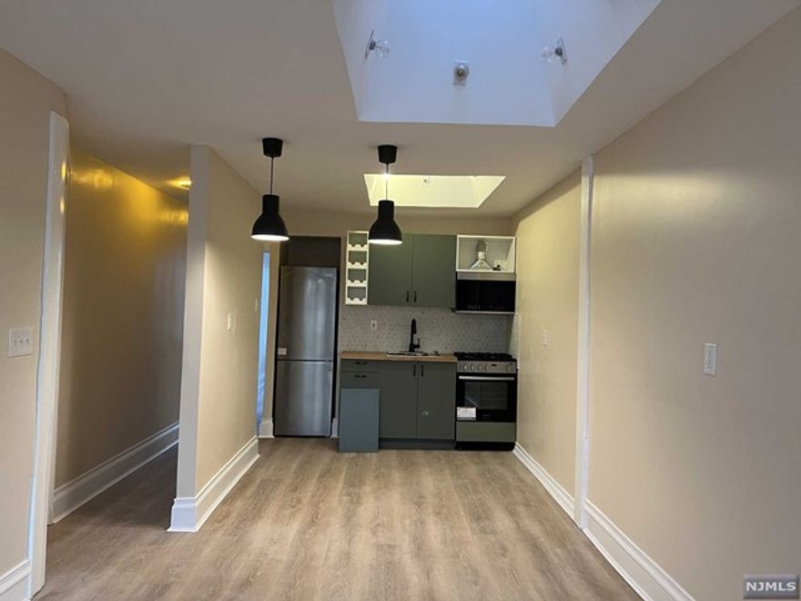 Wow! Completely renovated!!! Hardwood floor throughout. Open kitchen. High ceiling skylights. Spacious living room has enough space to make second bedroom if needed. . High ceiling skylights. All brand new appliances. Very convenient location for shopping and dining. NYC bus is right in front of the building. One parking, heat, water, hot water are included in rent.