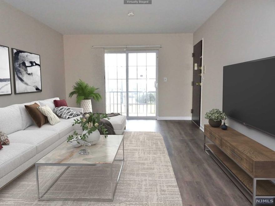 WHY PAY RENT? Just Improved ground floor condo is move-in ready. No stairs for easy living. Just installed new laminate wood floors throughout, interior freshly painted with neutral modern color, large EIK w brand new appliances, updated Full bath w brand new vanity and more. Assigned parking space. Central AC and more! Centrally located close to shops, dining and transp. A Must See!