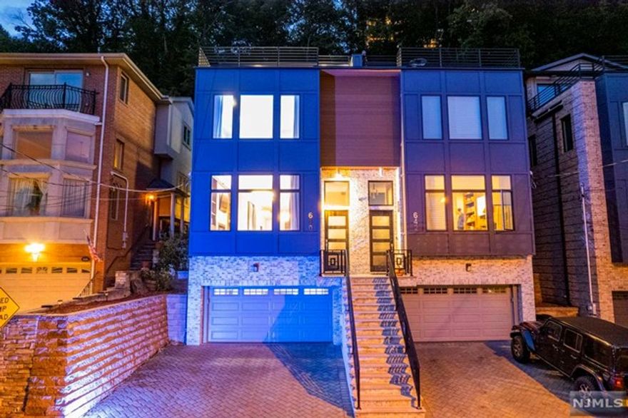 2017' Contemporary built w/top quality construction with nice finishes. Home has 10" ft ceiling on main level and 9" ft on upper level. Very sleek gourmet kitchen with all high end appliances. Owner made recent upgrades, such as the glass walled staircase & LED lighting. Home has generous space with two Master Suites! The second master suite is on the top floor w/it's own access to private outside patio, and wooded hillside above. Also a sky room w/wall of glass separating the large roof deck w/NYC views. Choice location in Northern Edgewater for easy access in and out of town, plus very close to the park and NYC trans. No HOA fees!