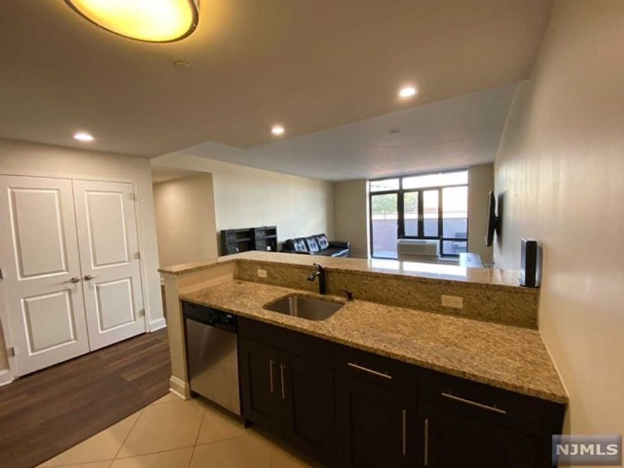 AVAILABLE 11/2 - NEWER CONSTRUCTION - NO REALTOR FEE - Liberty Realty presents The Marquee, Hackensack's Premier Luxury rental building. The Marquee offers 40 luxury 2 bed 2 bath rentals ranging from 1100 sq ft-1300 sq ft. This units features open kitchen layout with granite countertops, stainless steel appliances, dishwasher, balcony and hardwood floors. Apartments feature floor-to-ceiling windows, washer/dryer in unit, walk-in closets, marble bathrooms w/Jacuzzi tub, and dual vanity sinks. Building offers 2 Elevators and 2 Car Indoor parking available. Bus to NYC at corner, 2 Blocks to NYC train (NJ Transit). Close proximity to all major highways, malls, shopping and easy access to NYC. *NEW PICS COMING SOON!