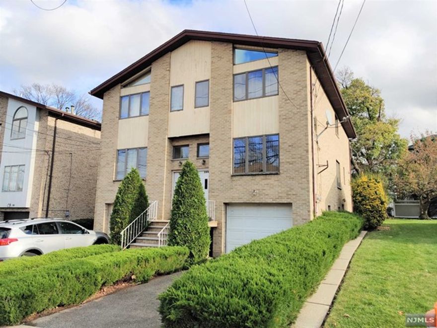 Nice and bright 3 bedroom, 3 1/2 bath duplex unit in convenient area of Fort Lee. Newly renovated kitchen with all new cabinets, countertops and stainless steel appliances. Kitchen with sliding glass door to deck. Newly tiled ground floor with full bathroom, separate entrance, laundry and access to one car garage. Close to shops, restaurants, school, NYC transportation and all major roads.