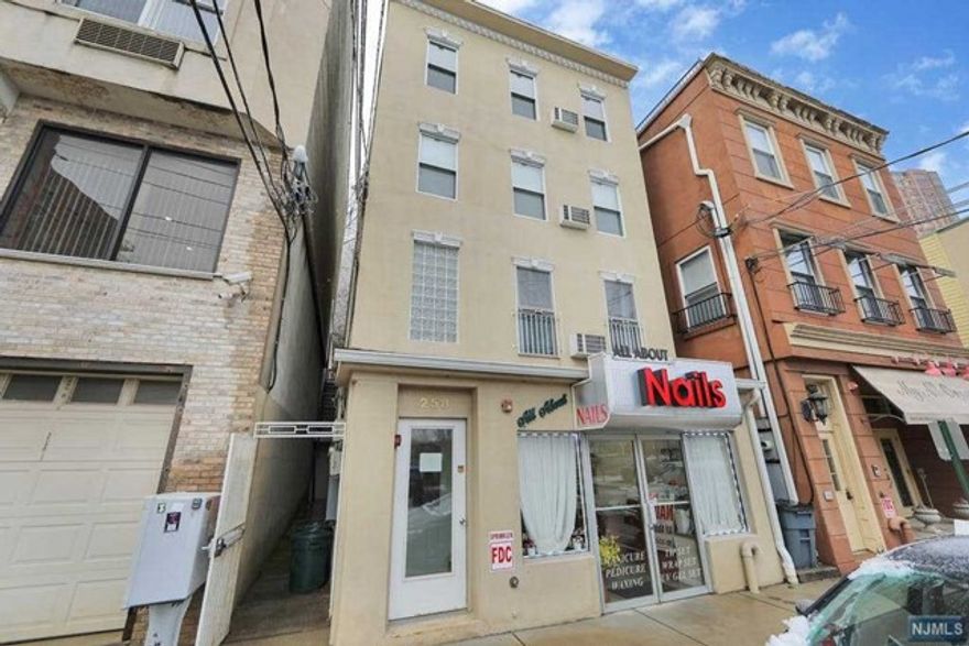 Building is fully rented with long term paying tenants and leases.1st floor Nail Salon $5000 PER MO. 2nd-floor 2 bed $2100, 3rd 1 bed $1900 PER MO, 4th floor 1 bed $1900. Must show pre-approval for a mixed use building before showing. 1 commercial space + 3 residential units. Laundry room.Free municipal parking with permit.