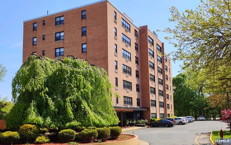 THIS BEAUTIFUL CONDO APARTMENT LOCATED IN THE DESIRABLE PARK HILL TERRACE COMMUNITY WELCOMES YOU WITH THE SPACIOUS OPEN CONCEPT THAT IS PERFECT FOR ENTERTAINING, LARGE BEDROOM AND AN ADDITIONAL DEN / OFFICE SPACE ADJACENT THE DINING AREA. APARTMENT IS COMPLIMENTED BY NATURAL WOOD PARQUET FLOORS THROUGHOUT, UPDATED BATHROOM AND AMPLE CLOSET SPACE. MAINTENANCE INCLUDES HOT / COLD WATER AND ONE OUTDOOR PARKING SPACE. ALL THIS WITHIN BEAUTIFUL GREEN STREETS OF LINWOOD PARK WITH SHOPPING PLAZA AND NYC TRANSPORTATION AT YOUR DOOR!