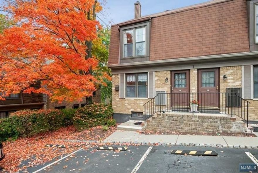 Spacious end unit in an ideal location! Bright and airy townhome offers 3 levels of living space in the sought-after Inwood at Great Notch community. Enjoy carefree living in a park-like setting tucked into the woody foothills of lower Passaic County. Just 12 miles to the Lincoln Tunnel, this home is ideal for commuters, w/a bus stop right around the corner & 2 train stations for the Midtown Direct to NYC. On the main level, the foyer flows to a large, bright kitchen w/ample counter and cabinet space & a pass-through to the dining area. The open layout continues to the LR w/a corner wood-burning fireplace & sliding glass doors to a small patio & woodsy views of the grounds. The 2 floor includes the primary bedroom w /large double closets & en-suite bathroom, a 2nd bedroom & a full bathroom in the hallway. The basement level offers a large recreation room that could be used as an office, a powder room, WIC & laundry area. Quick access to major highways, Rt 46,23 & 80.