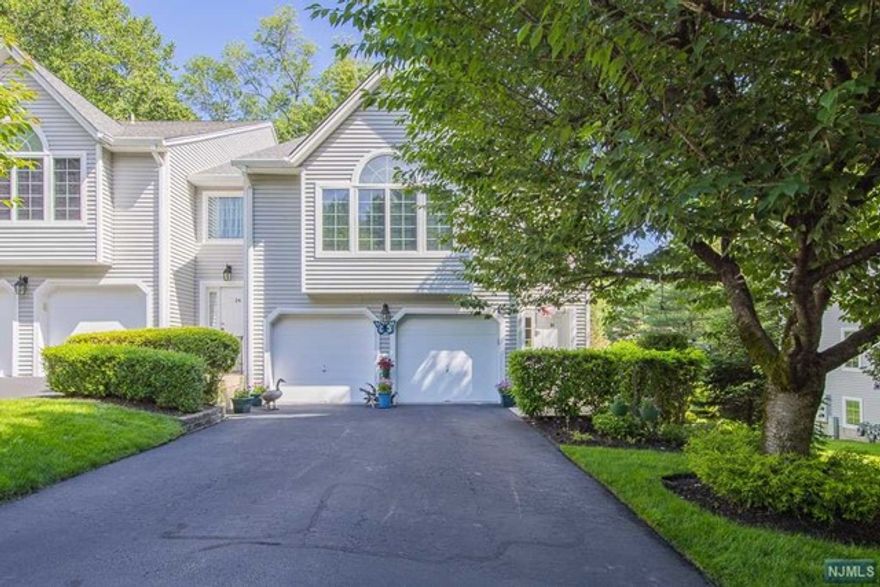 Discover your dream home in the heart of Hillsdale, NJ! This stunning 3-bedroom, 2.5-bathroom end unit townhouse offers it all! Enjoy the open and airy feel of the primary bedroom with a cathedral ceiling and an adjacent loft that can serve as a cozy office space. The kitchen features elegant maple cabinets, a functional island with two stools, and a durable ceramic tile floor ideal for cooking and entertaining. Step outside to a deck equipped with a natural gas line, perfect for BBQs and outdoor gatherings. Relax in the primary bath's Jacuzzi tub or enjoy a quick shower; this bathroom offers both for your convenience. Park with ease in the two-car garage, and enjoy the comfort of a well-maintained home theater in the lower level, complete with a sound system and theater seats. Situated in a desirable neighborhood, this townhouse is in close proximity to Stonybrook Swim Club, Edgewood Country Club and Beechwood Park. Your beautiful new home awaits!